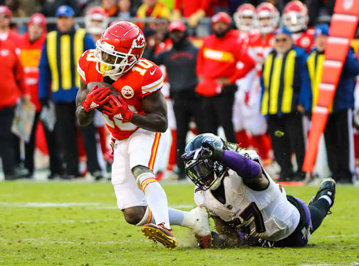 Dec 9, 2018; Kansas City, MO, USA; Kansas City Chiefs wide receiver Tyreek Hill (10) runs against Baltimore Ravens linebacker C.J. Mosley (57) at Arrowhead Stadium. Mandatory Credit: Jay Biggerstaff-USA TODAY Sports